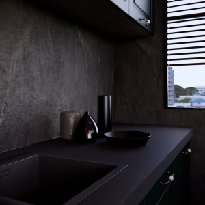 Lapitec Nero Assoluto kitchen counter in the Vesuvio finish, with an integrated sink and a dark backsplash