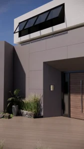 House entrance clad in large grey Lapitec Grigio panels, with a wooden door and plants