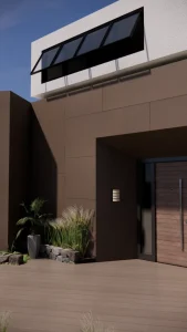 House entrance clad in large dark-brown Lapitec Terra Moca panels, with a wooden door and plants