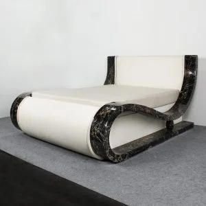 Riposo Stone Bed: white bed with a curved frame in black-and-gold Nero Portoro Gold marble