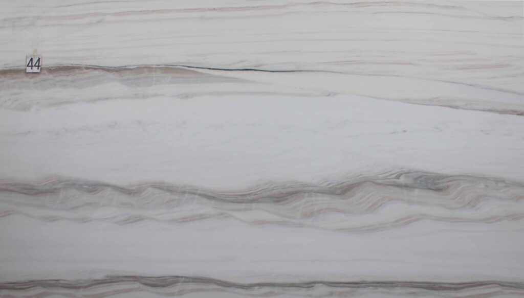 Bianco Sand Dunes quartzite slab, white with wavy light-brown bands