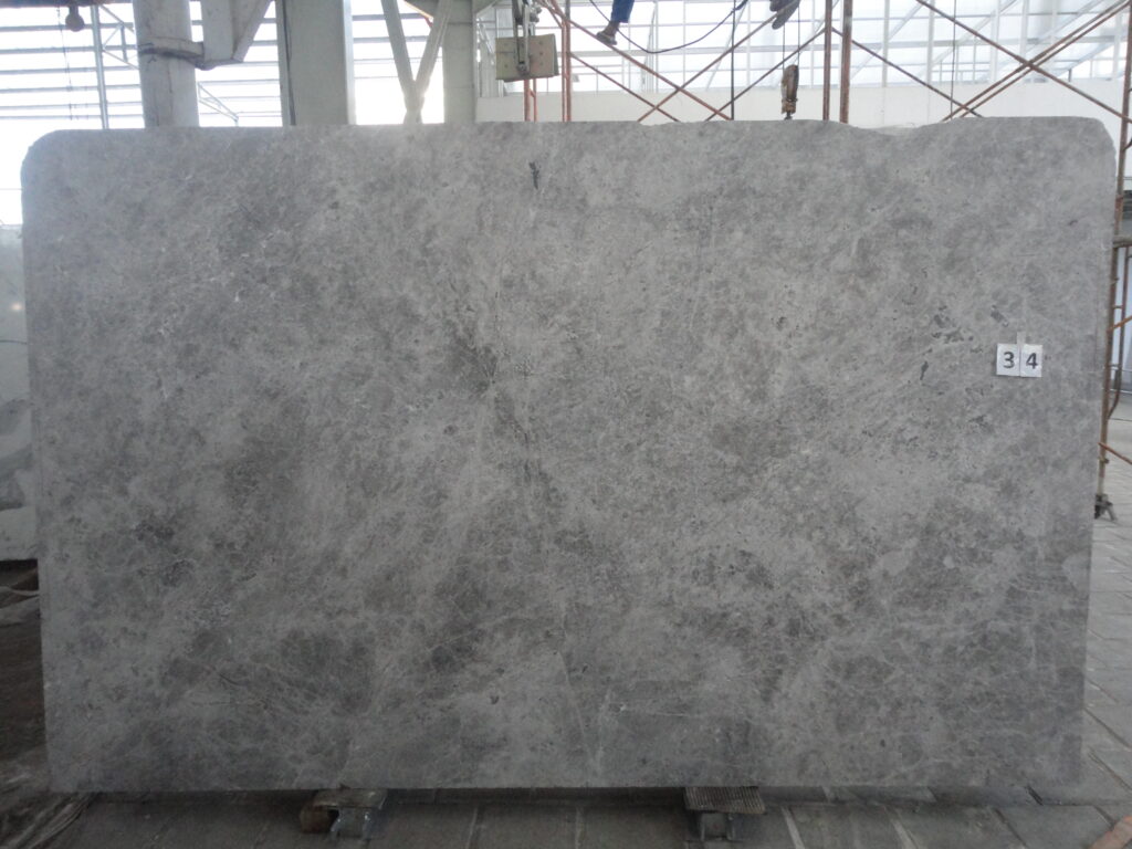 Fendi Grey marble slab with a grey base and a soft cloudy pattern