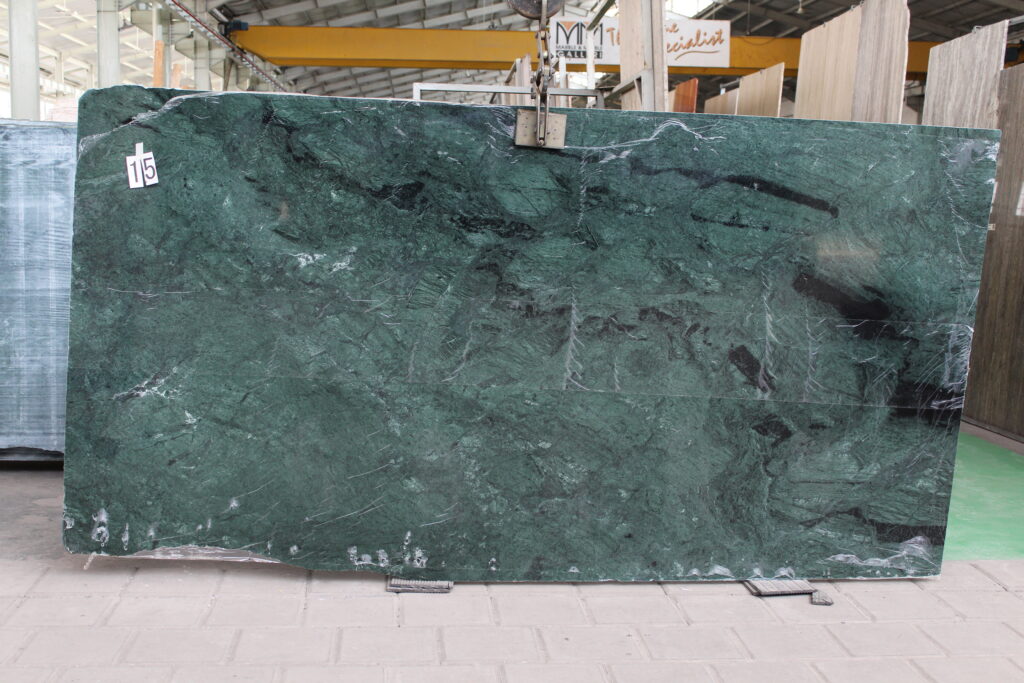 Verde Patricia marble slab, dark green with white veins and flecks