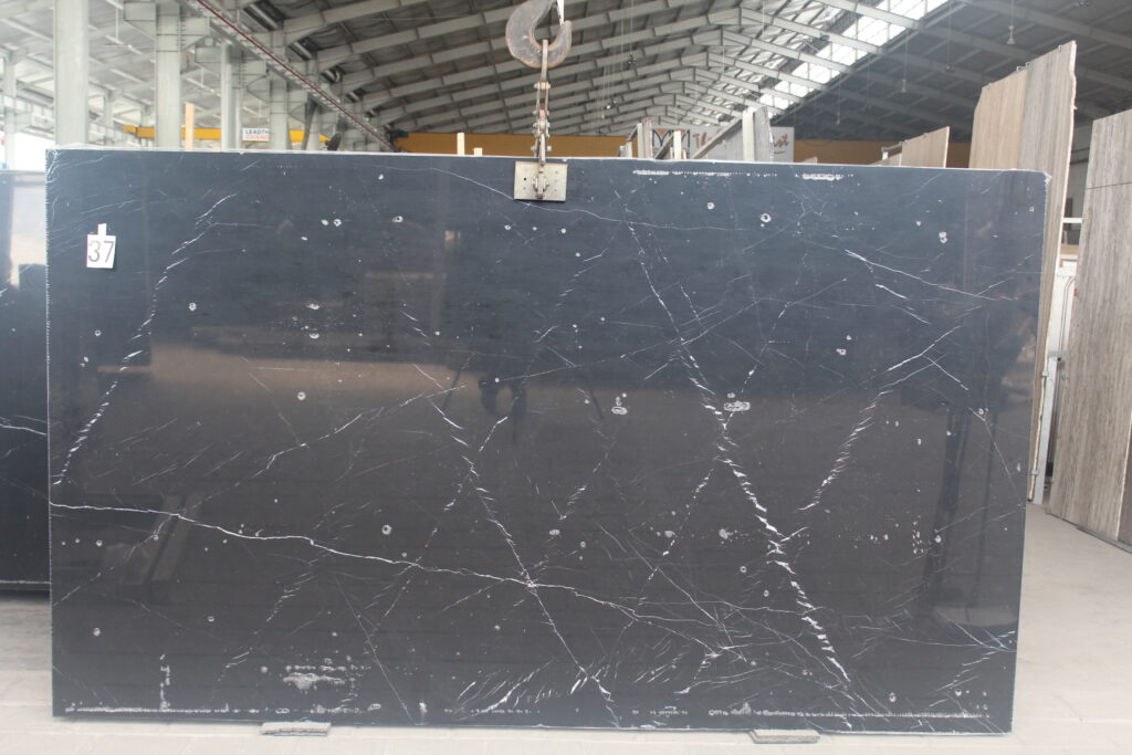 Nero Marquina marble slab, deep black with thin white veins