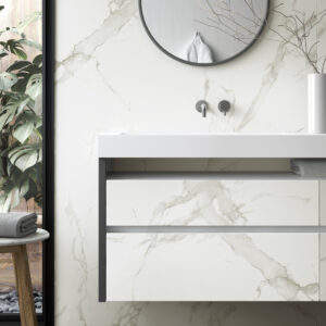 Bathroom basin and wall in white marble-look Dekton, with a round mirror