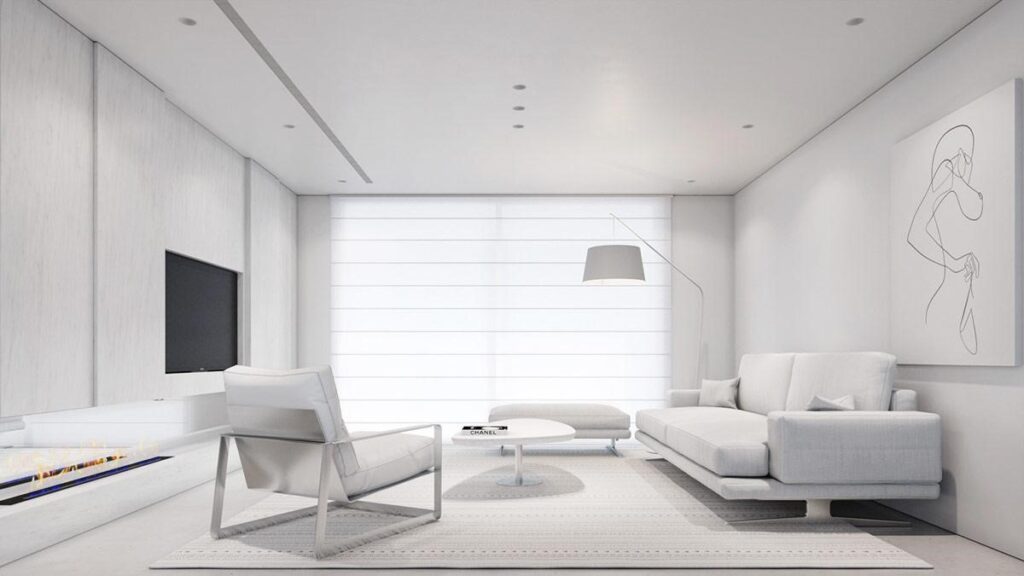 All-white living room with white sofas, a lounge chair, a floor lamp and sheer curtains